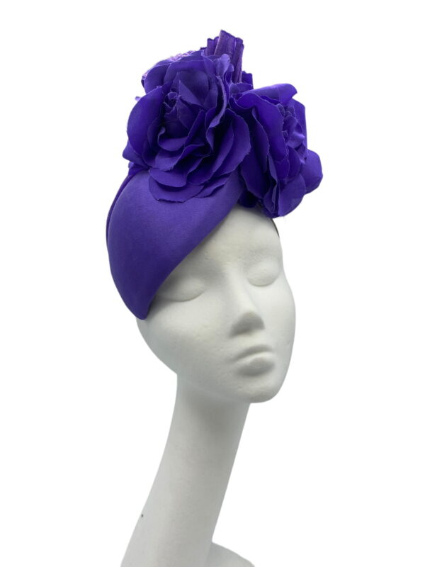 Stunning purple headpiece with flower detail to finish.
